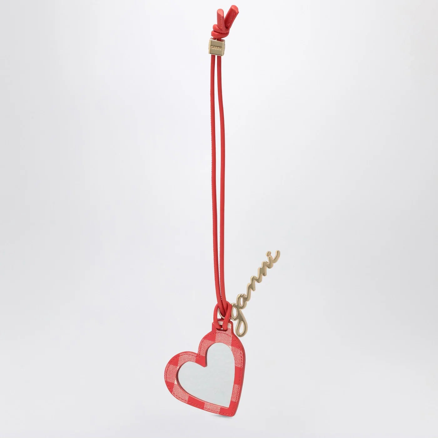 GANNI Heart-shaped mirror Bou red