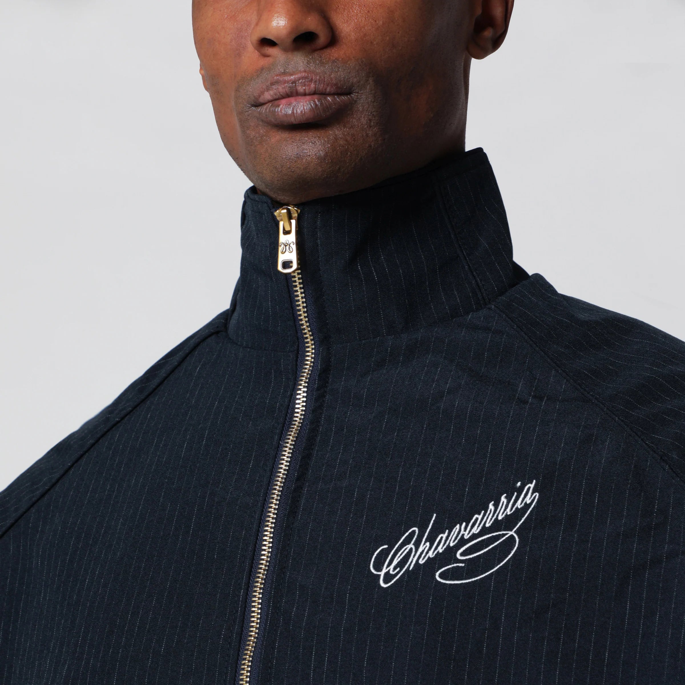 Willy Chavarria Pinstripe zip-up jacket with logo embroidery
