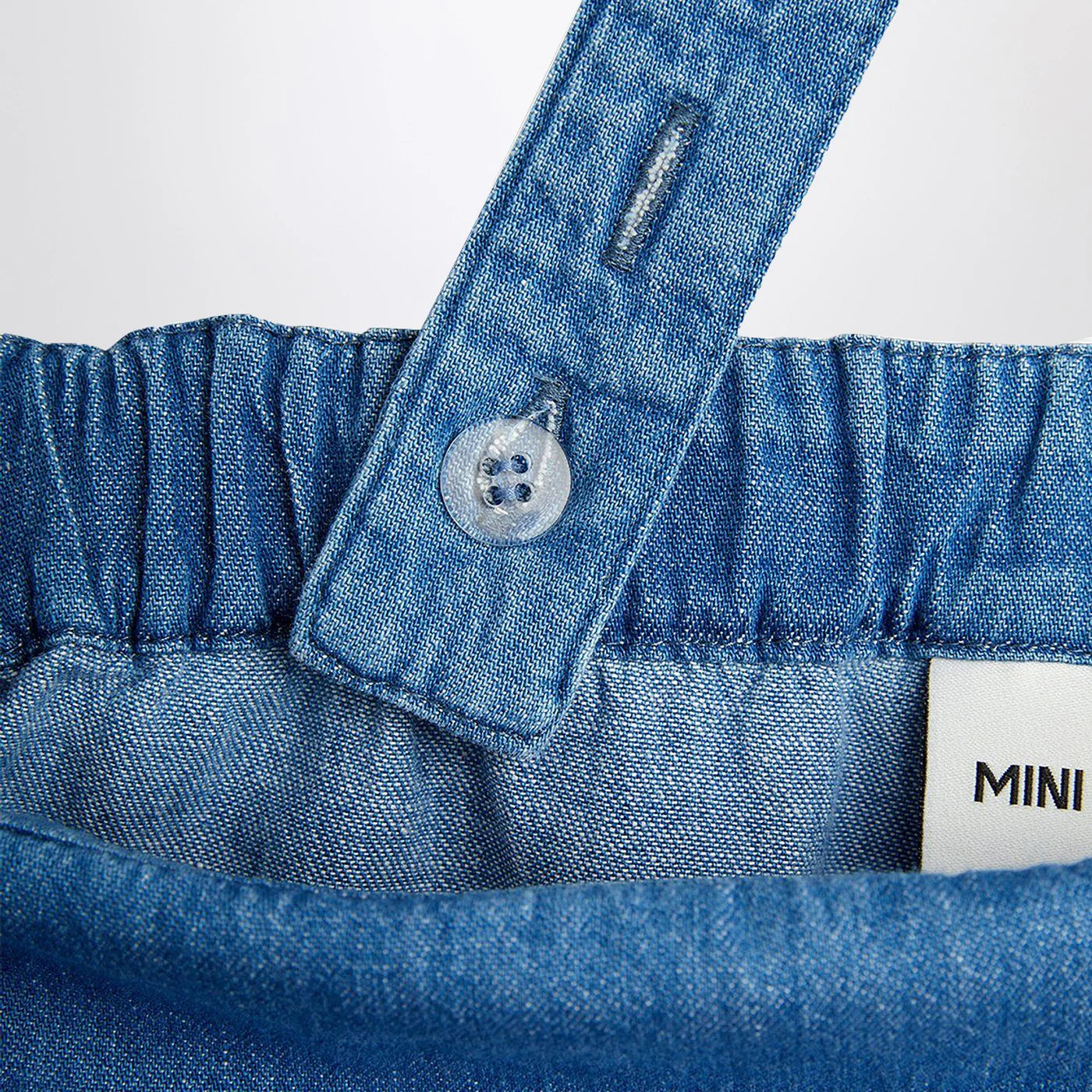 Mini Rodini Light blue denim overall with musical notes