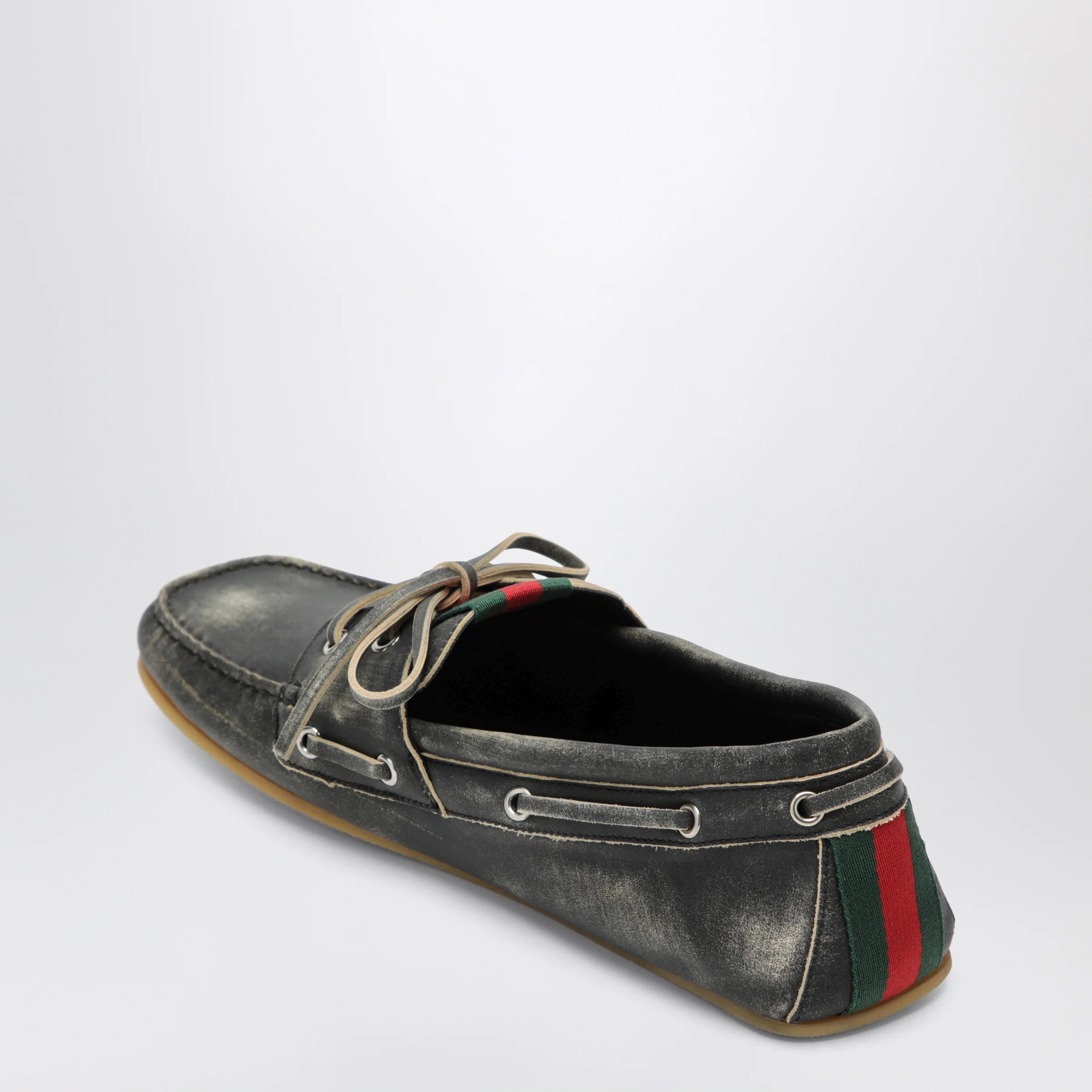 GUCCI Black boat shoes with washed effect
