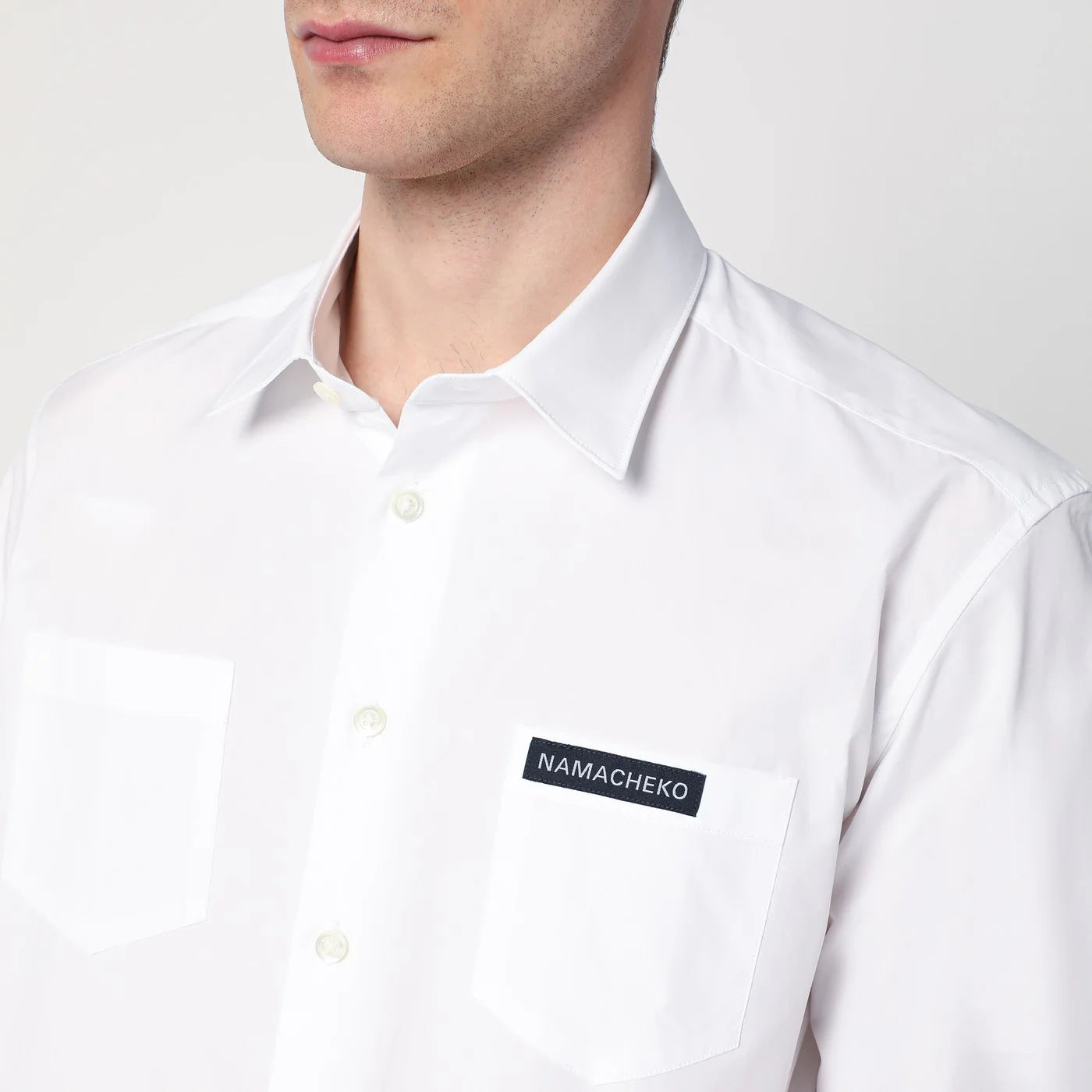 NAMACHEKO White shirt with logo patch