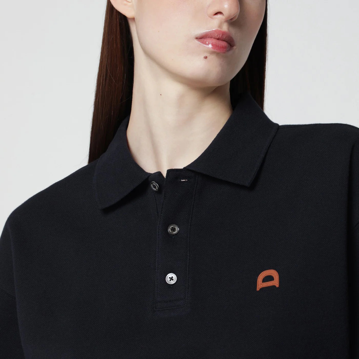 Dunst Navy blue polo shirt with leather logo